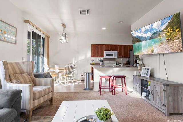91-6221 Kapolei Pkwy Unit 235, Ewa Beach, HI 96706 - living room with light colored carpet and recessed lighting