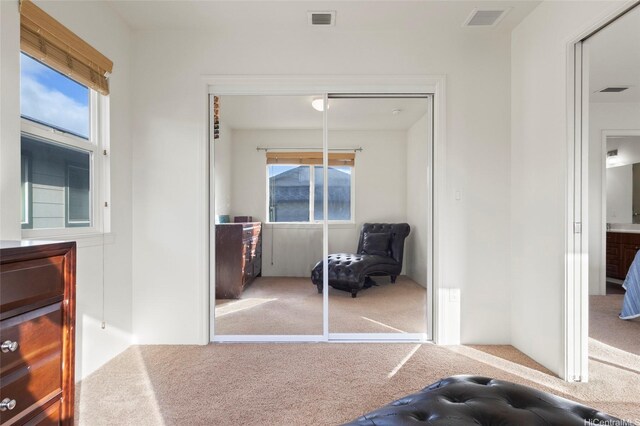 91-6221 Kapolei Pkwy Unit 235, Ewa Beach, HI 96706 - carpeted bedroom featuring a closet and multiple windows