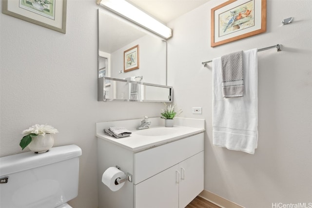 bathroom with vanity and toilet