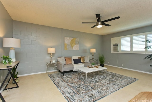 living room featuring ceiling fan, cooling unit, and a textured ceiling