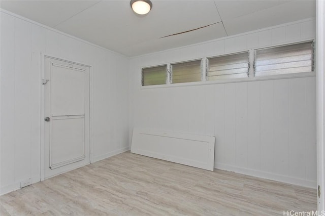 unfurnished room with light hardwood / wood-style floors