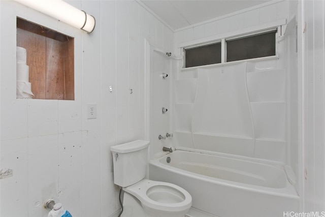 bathroom with toilet, tub / shower combination, and wood walls