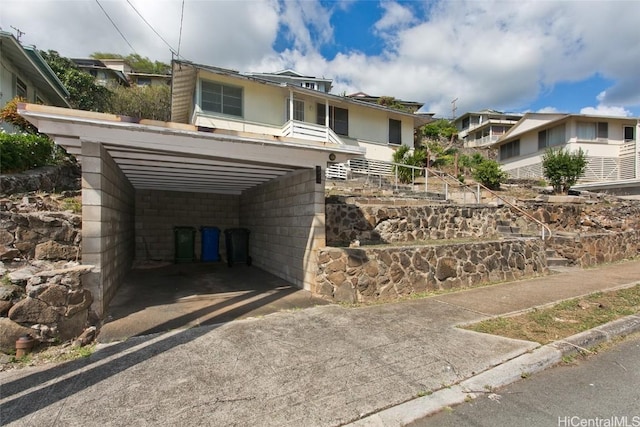 view of front facade with a carport