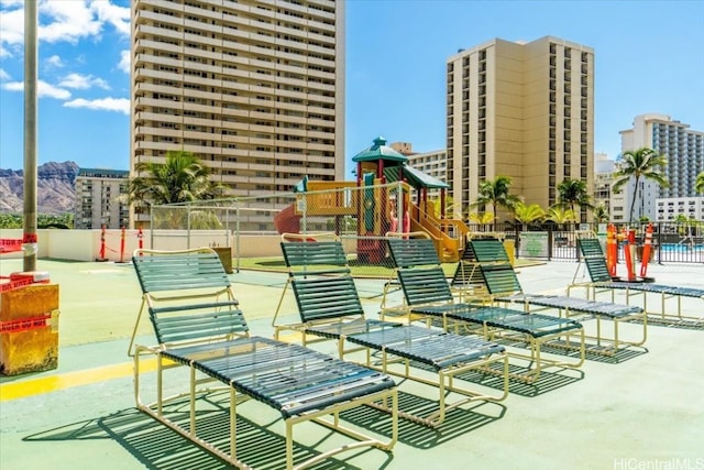 view of property's community with a playground