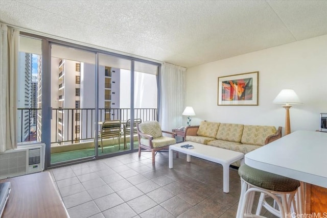 living room with tile patterned flooring and a wall of windows