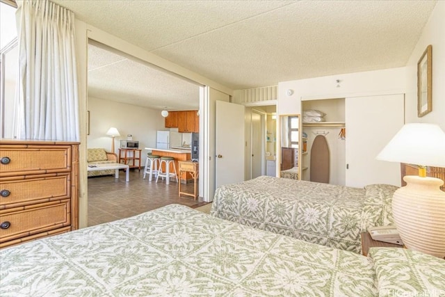 bedroom with a closet and a textured ceiling