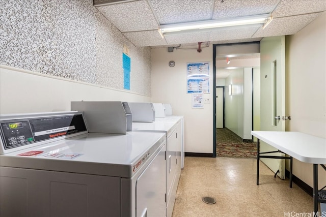 clothes washing area featuring separate washer and dryer