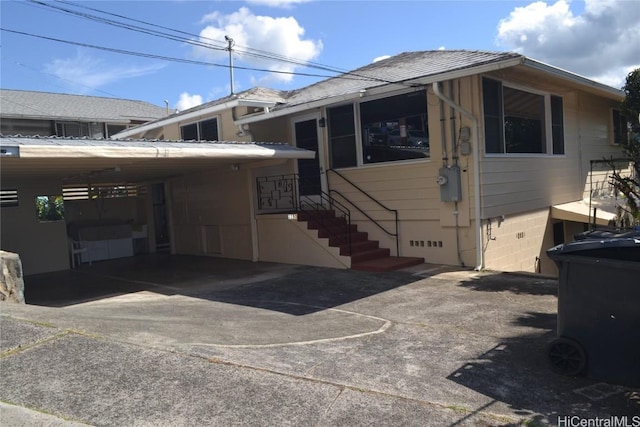 exterior space featuring a carport