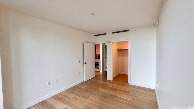 empty room with light wood-type flooring