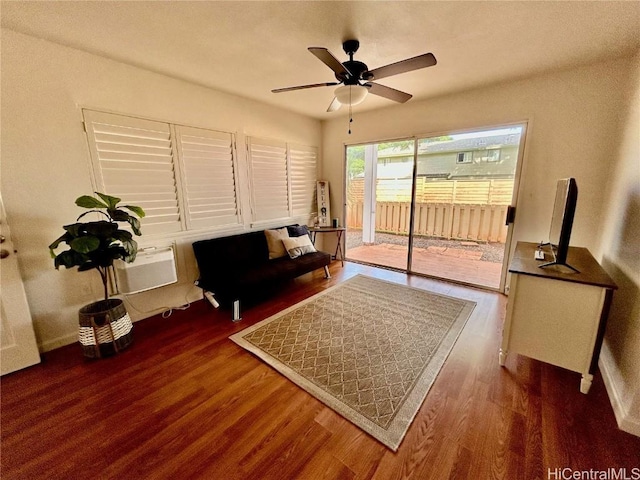 interior space featuring dark hardwood / wood-style floors, ceiling fan, and an AC wall unit