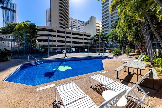 view of pool featuring a patio