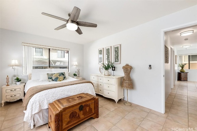 tiled bedroom with ceiling fan