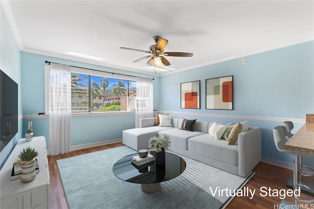 living room featuring ceiling fan, dark hardwood / wood-style flooring, and ornamental molding