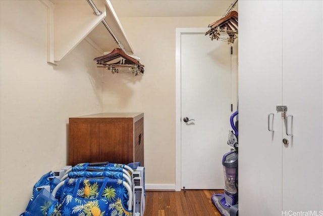 bedroom with dark wood-type flooring