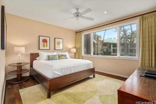 bedroom featuring hardwood / wood-style flooring and ceiling fan