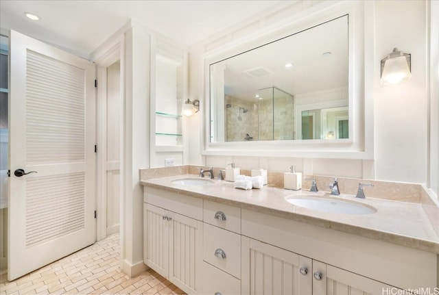 bathroom with vanity and a shower with shower door