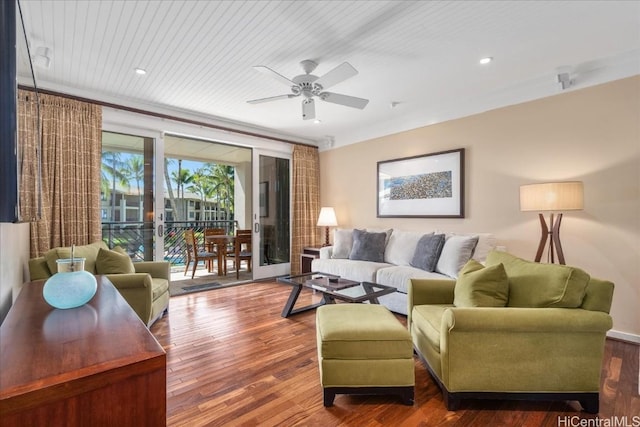 living room with ceiling fan, dark hardwood / wood-style flooring, and wood ceiling