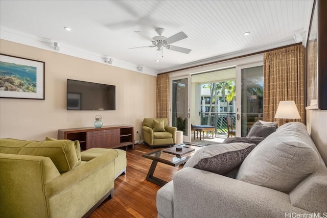 living room featuring dark hardwood / wood-style flooring, wooden ceiling, ceiling fan, and ornamental molding