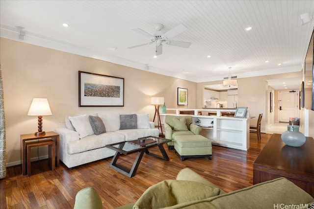 living room featuring wood ceiling, ceiling fan, crown molding, and dark wood-type flooring