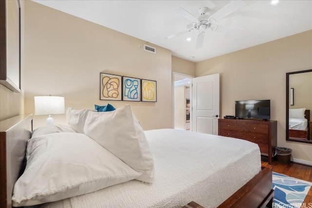 bedroom with ceiling fan and dark wood-type flooring