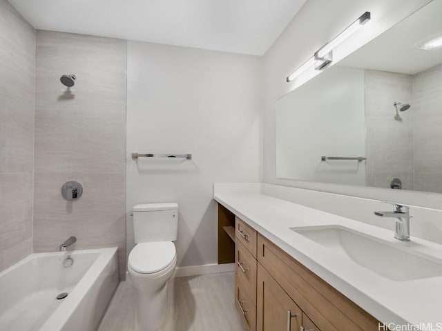 full bathroom featuring vanity, toilet, and tiled shower / bath combo