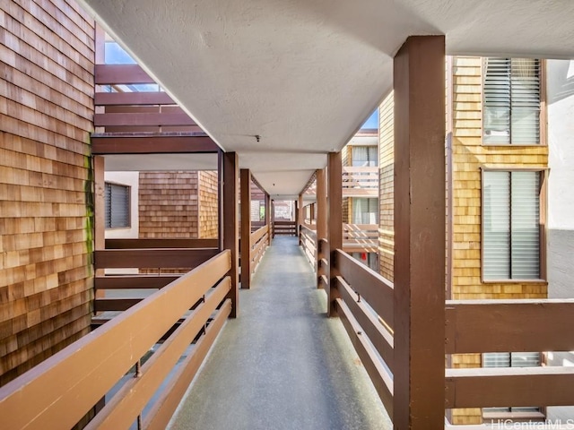 hall with a textured ceiling