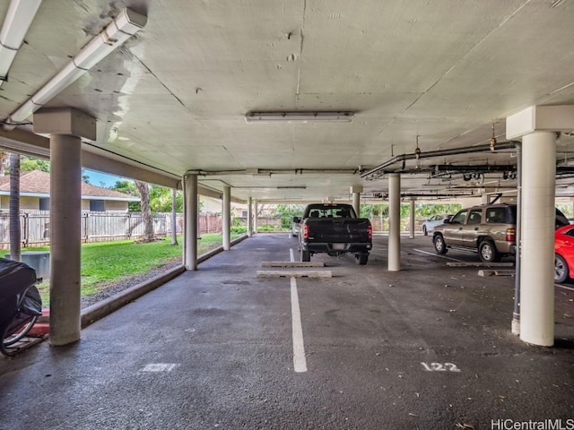 garage featuring a carport