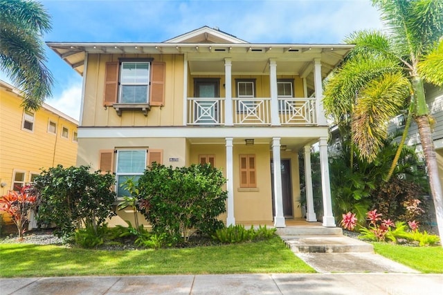 view of front of home with a balcony