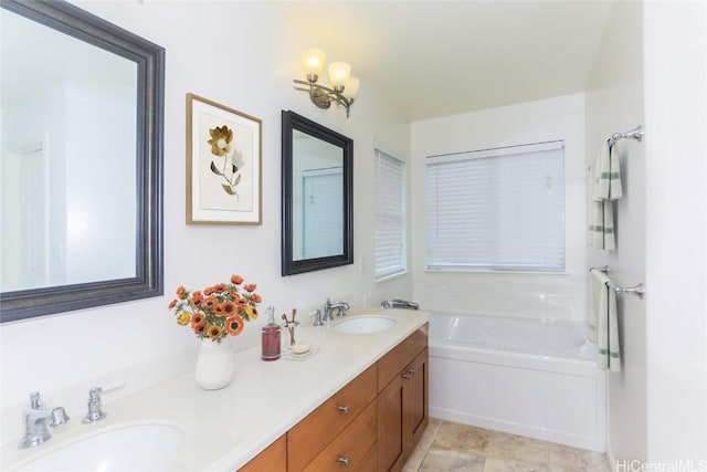 bathroom with a washtub and vanity