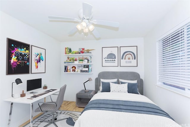 bedroom featuring ceiling fan and wood-type flooring