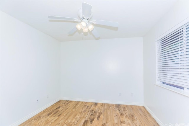 unfurnished room with ceiling fan and light wood-type flooring