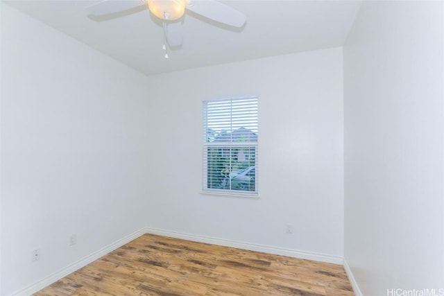 unfurnished room with ceiling fan and wood-type flooring