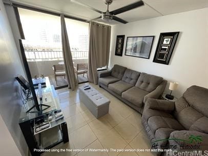 tiled living room featuring ceiling fan