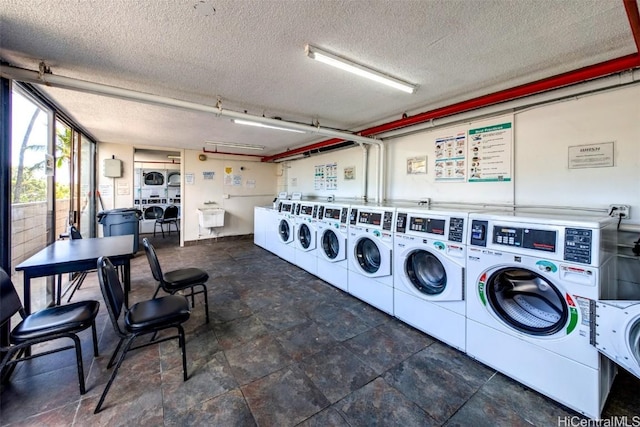 laundry room featuring a textured ceiling, stacked washer and clothes dryer, and independent washer and dryer