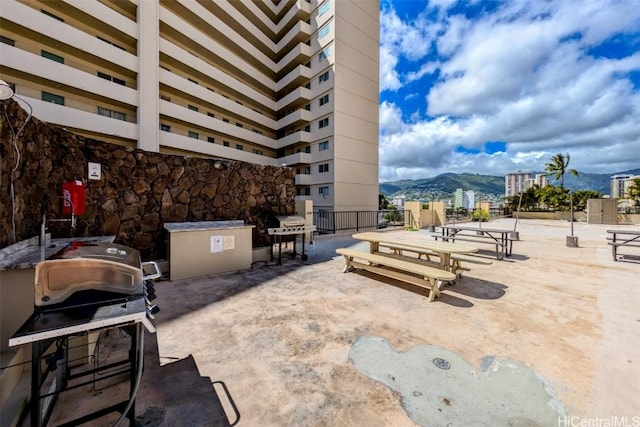 view of patio / terrace with a mountain view