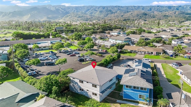 birds eye view of property with a mountain view