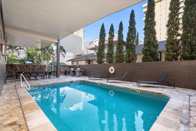 view of pool featuring a patio