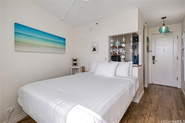 bedroom featuring dark hardwood / wood-style flooring