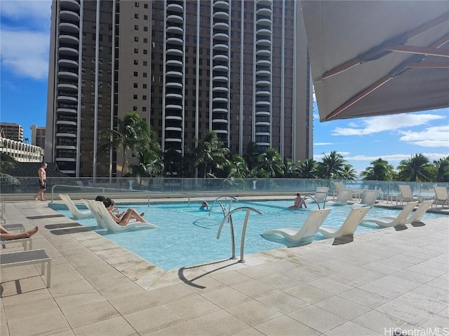 view of swimming pool with a patio