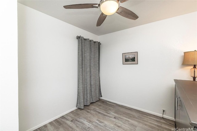 unfurnished room featuring ceiling fan and light hardwood / wood-style floors