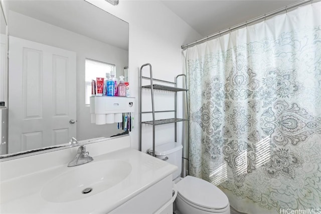 bathroom with vanity and toilet