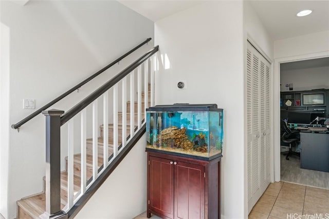 staircase with tile patterned flooring