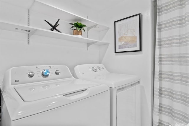 laundry area with separate washer and dryer