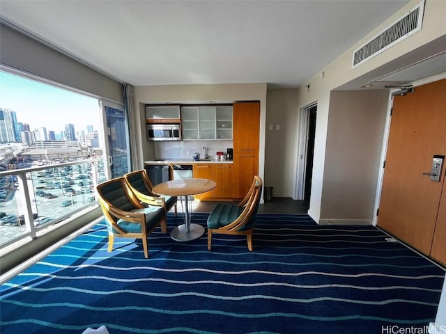 interior space with dark colored carpet and sink