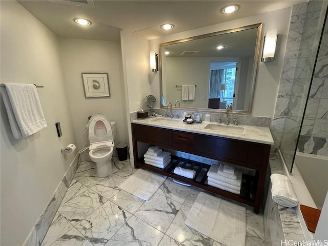 bathroom featuring vanity and toilet