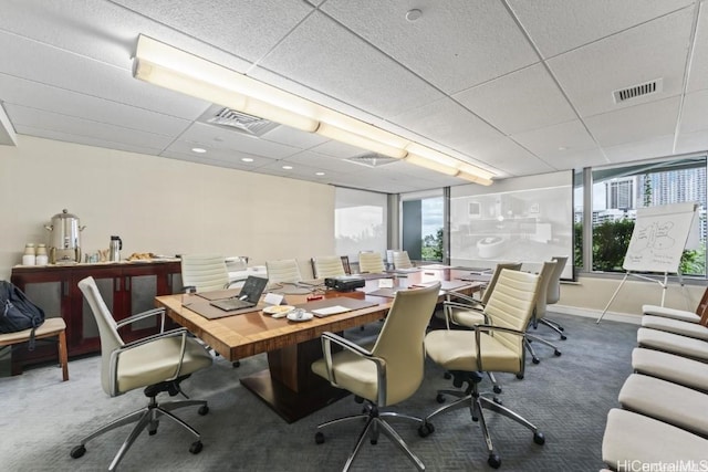 office area featuring dark colored carpet