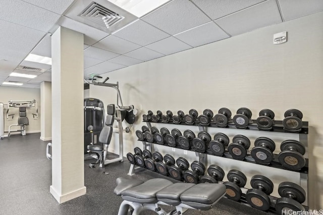 workout area featuring a drop ceiling