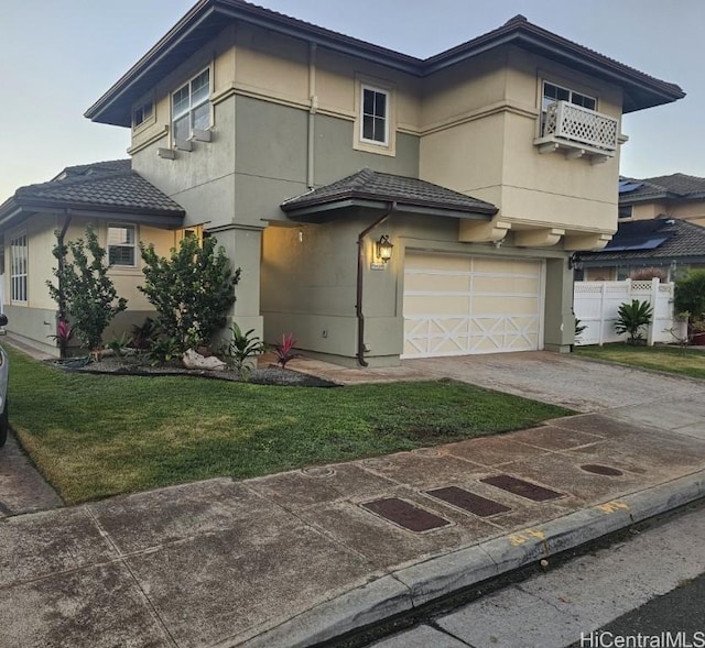 view of front of home with a garage and a front yard