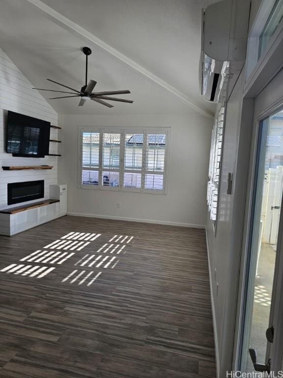 unfurnished living room with a large fireplace, a wealth of natural light, and dark hardwood / wood-style flooring