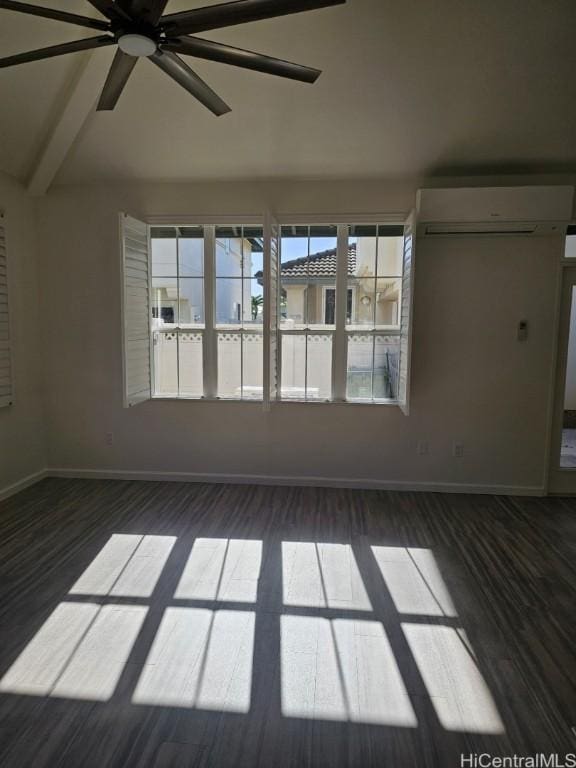 spare room featuring a wall unit AC, vaulted ceiling with beams, and ceiling fan